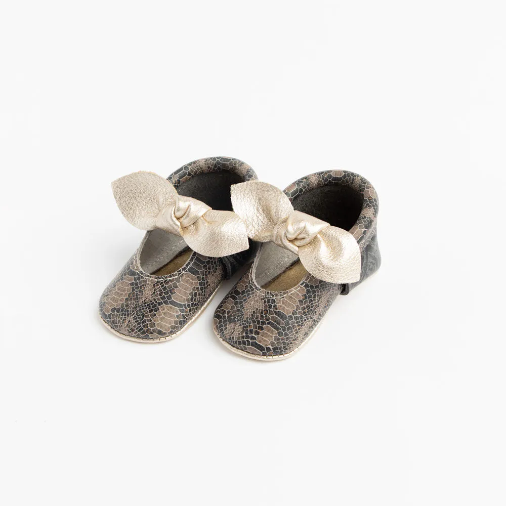 Freshly Picked Platinum Snakeskin Knotted Bow Soft Sole Moccasins